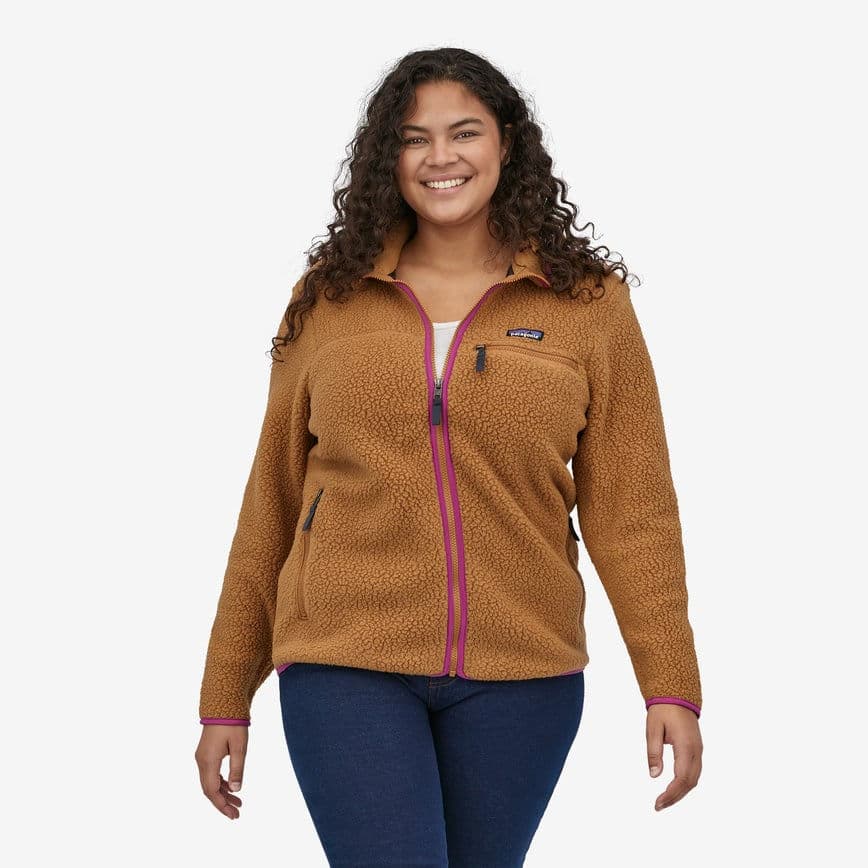 Person wearing a brown Patagonia ethical and sustainable fleece jacket.