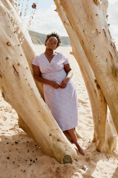 Person on a beach wearing a Seasalt dress