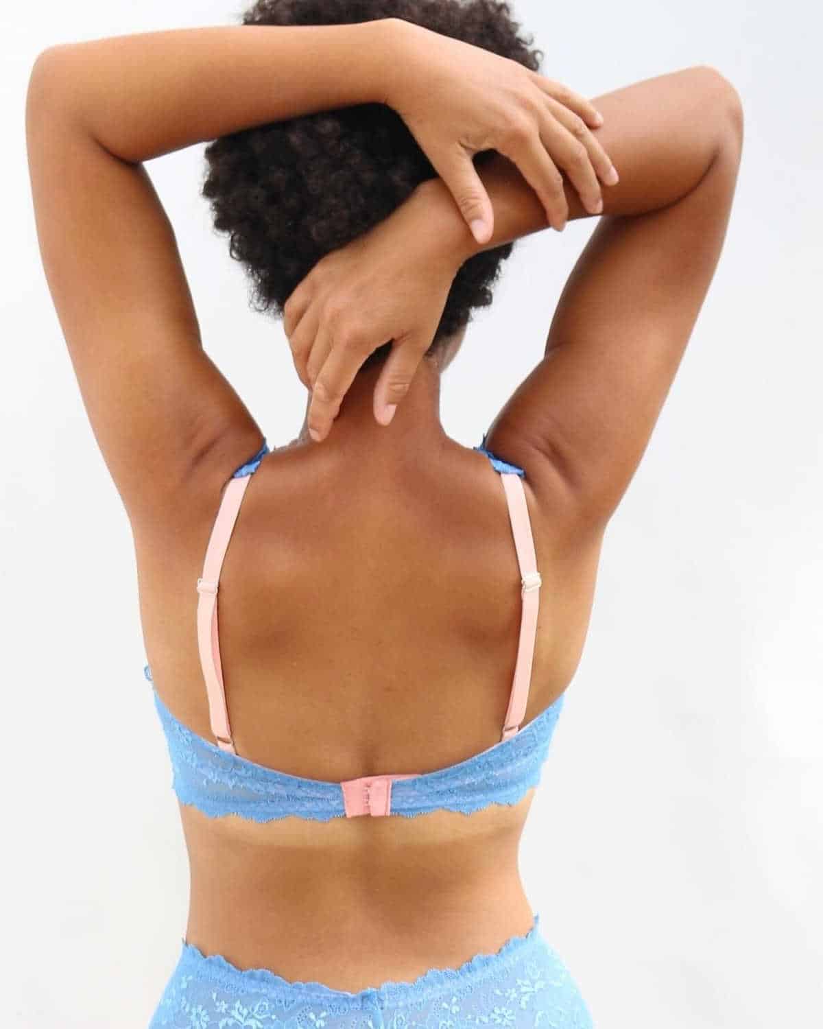 Back view of a person wearing blue lacey underwear from Brighton Lace