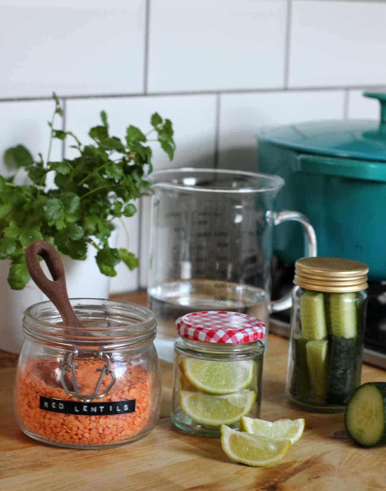 Food stored in glass jars sitting on a wooden worktop