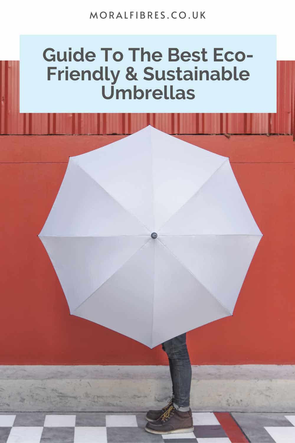 Person holding a white umbrella against a red wall, with a blue text box that reads guide to the best eco-friendly and sustainable umbrellas.